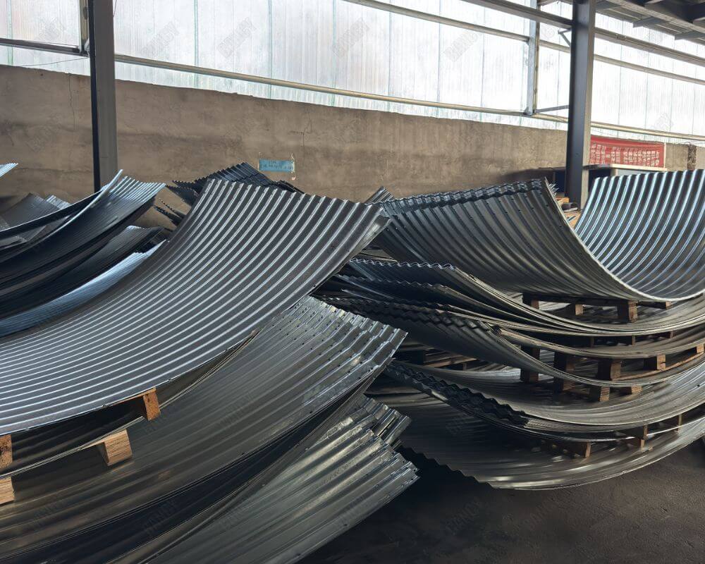Stacked curved metal sheets used for constructing aquaculture tanks