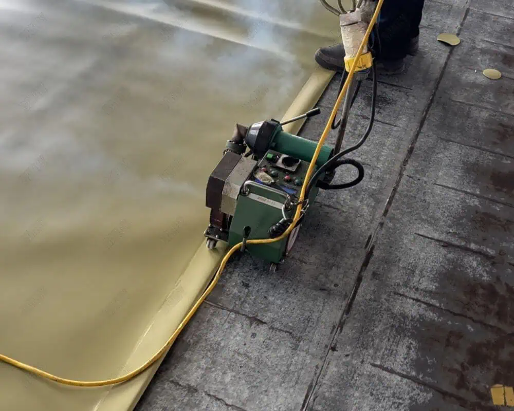 Welding equipment being used to heat seal materials for tank construction