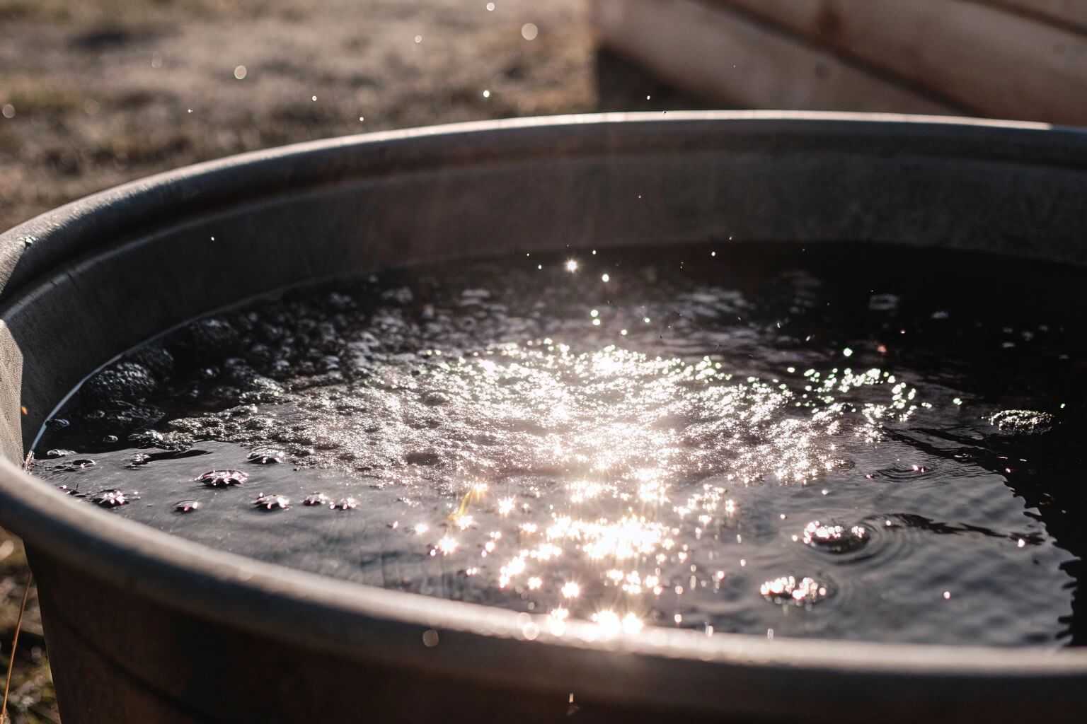 Water aging in an open container with sunlight and bubbles