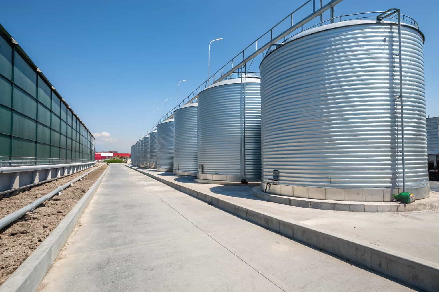 A commercial fish farm using large, galvanized sheet tanks