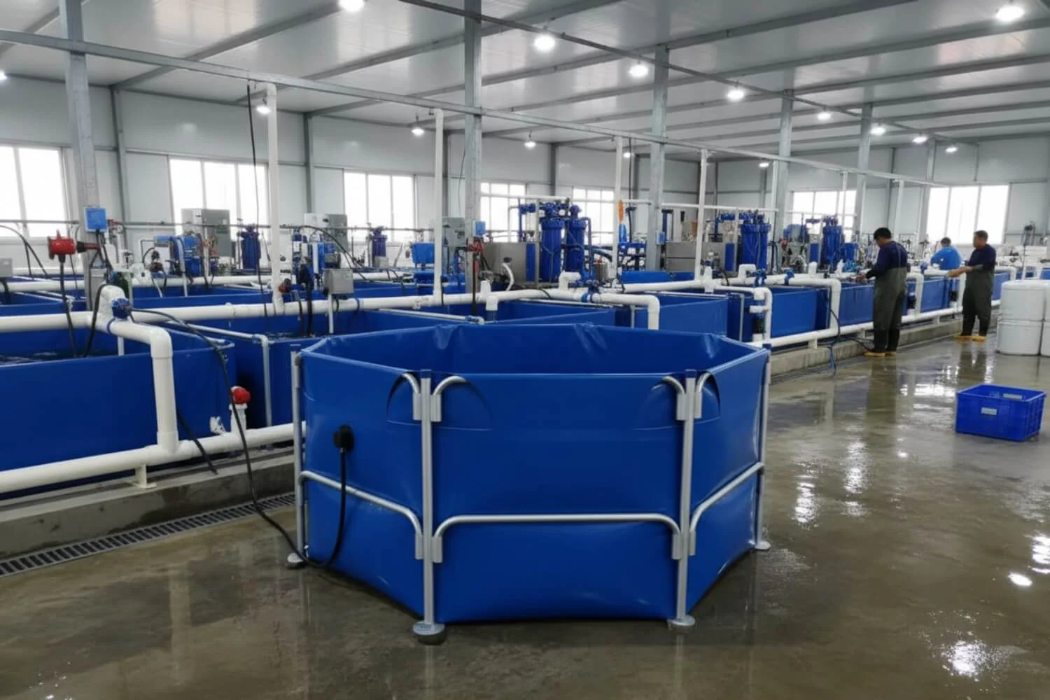 Rows of finished blue custom flexible tanks in the factory, featuring the specific valve configuration from the drawing.