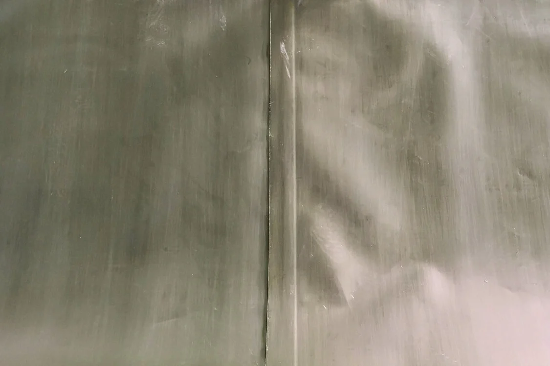 Close-up of a standard single weld seam showing structural weakness compared to Bancy reinforced flexible tanks.