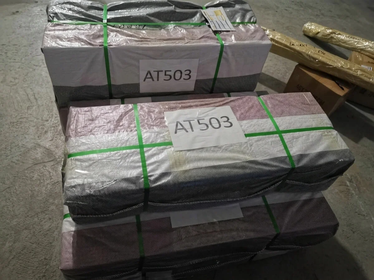 Small cardboard boxes containing the collapsible fish tank, demonstrating low shipping costs.