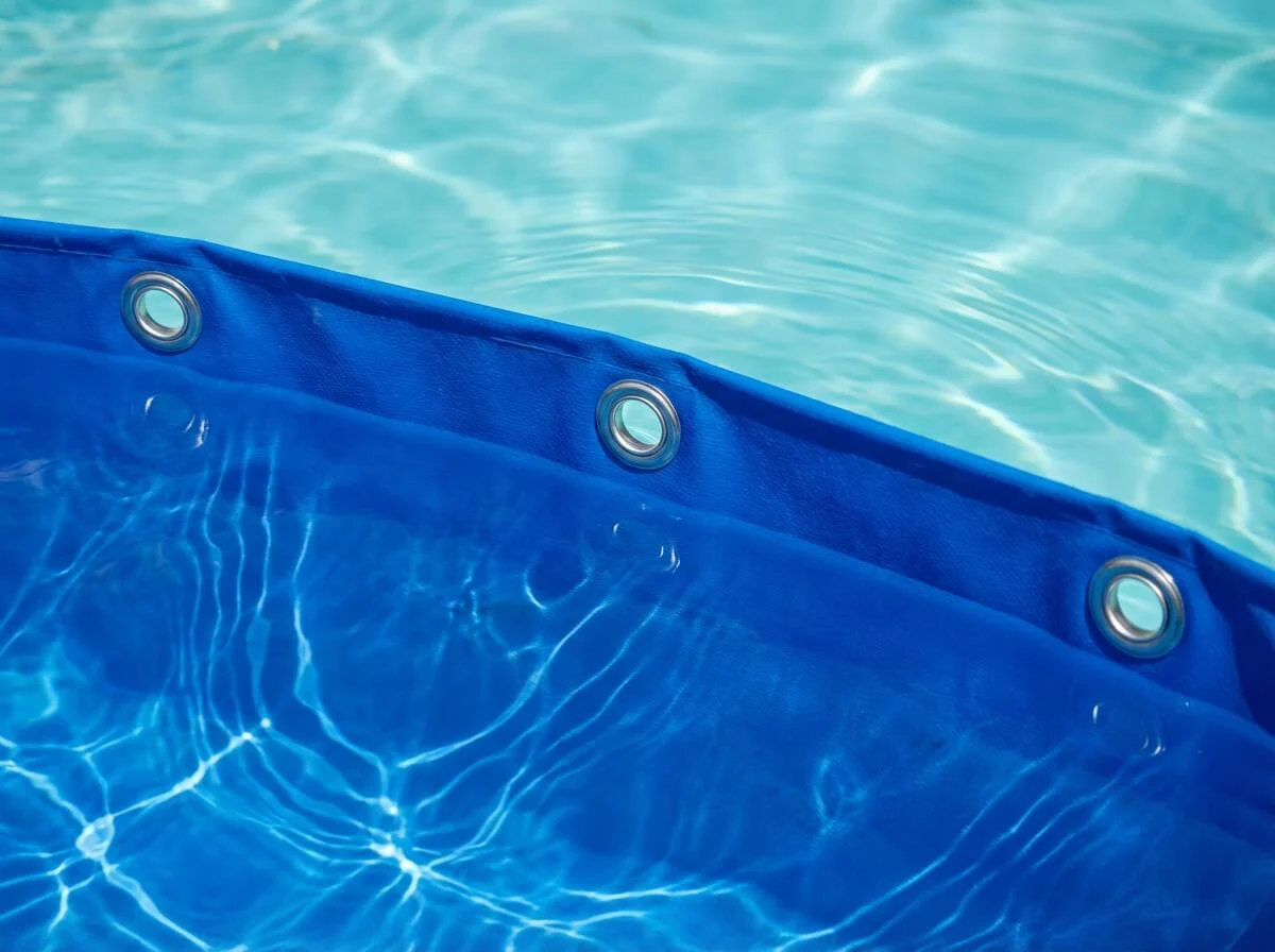 Clean water and fish inside a blue liner tank representing non-toxic materials.