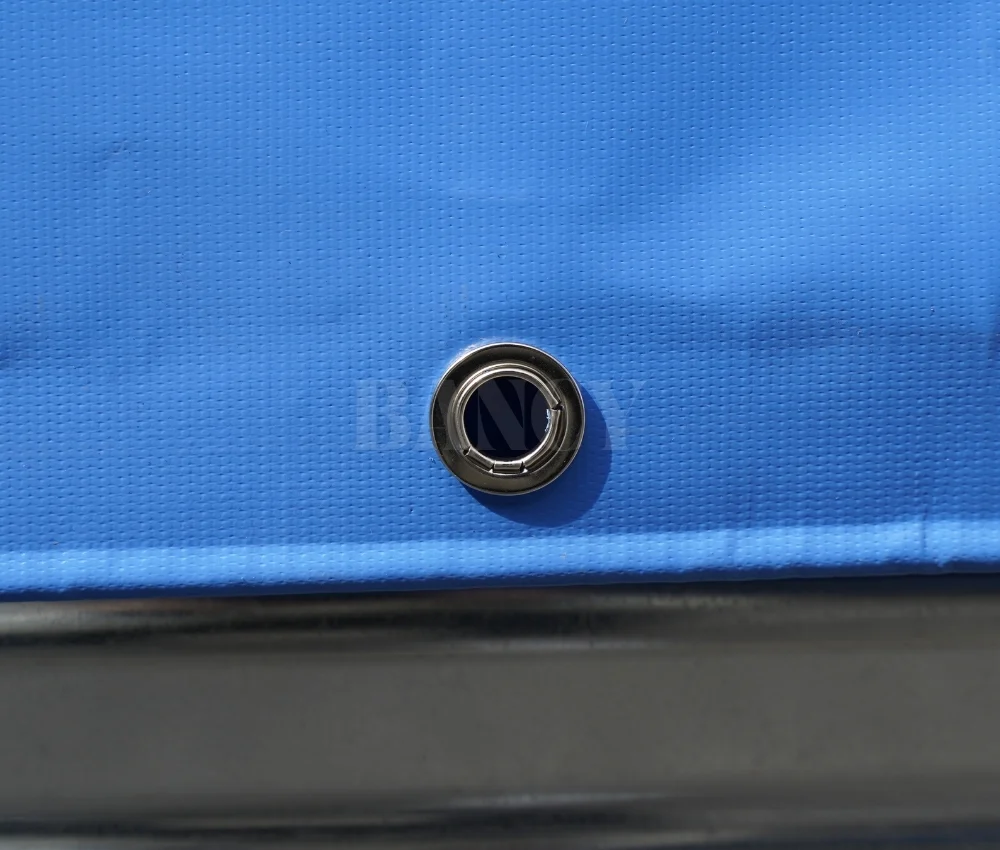 Top-down view of empty galvanized fish tank showing blue liner rim and circular shape.