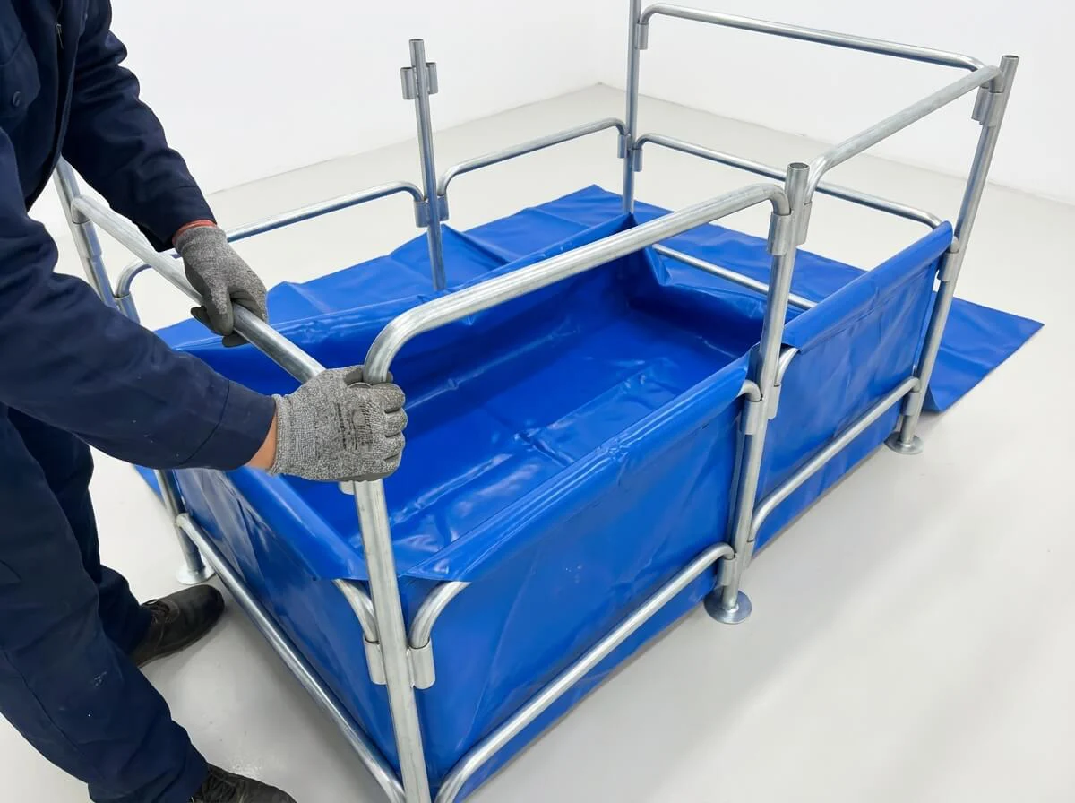 Hands of a worker easily connecting the steel frame tubes of the nursery tank without complex tools.