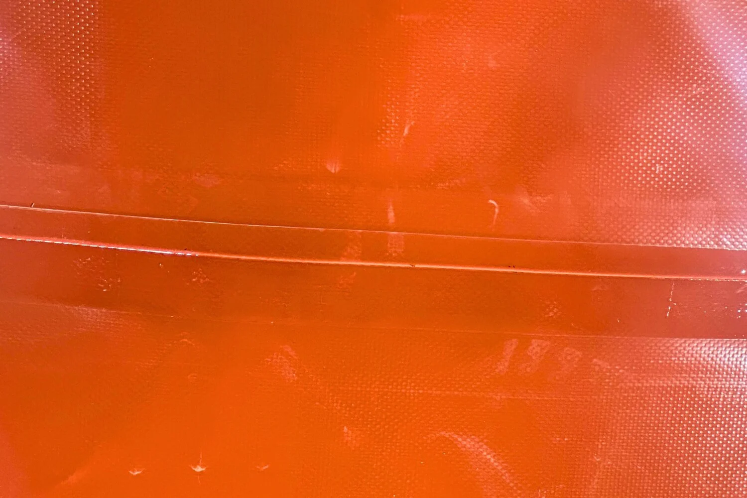 Technical diagram showing double-layer reinforced seam structure for water tanks