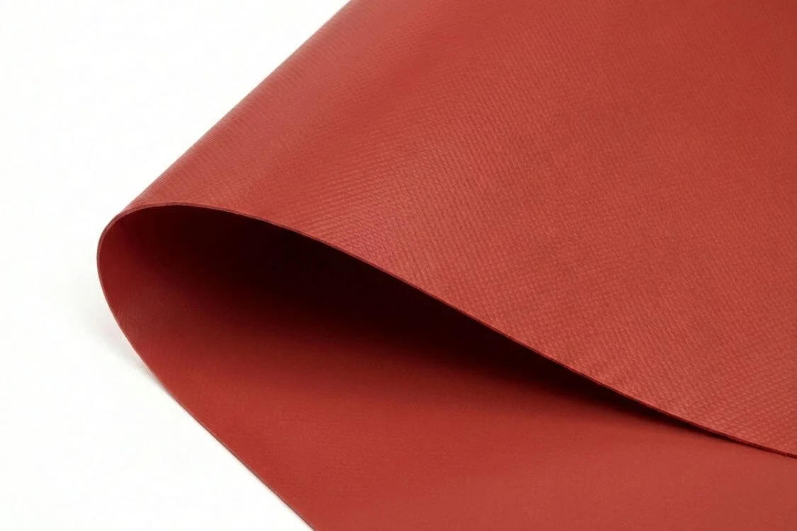 Close-up of UV-resistant red mud PVC fabric for biogas bags