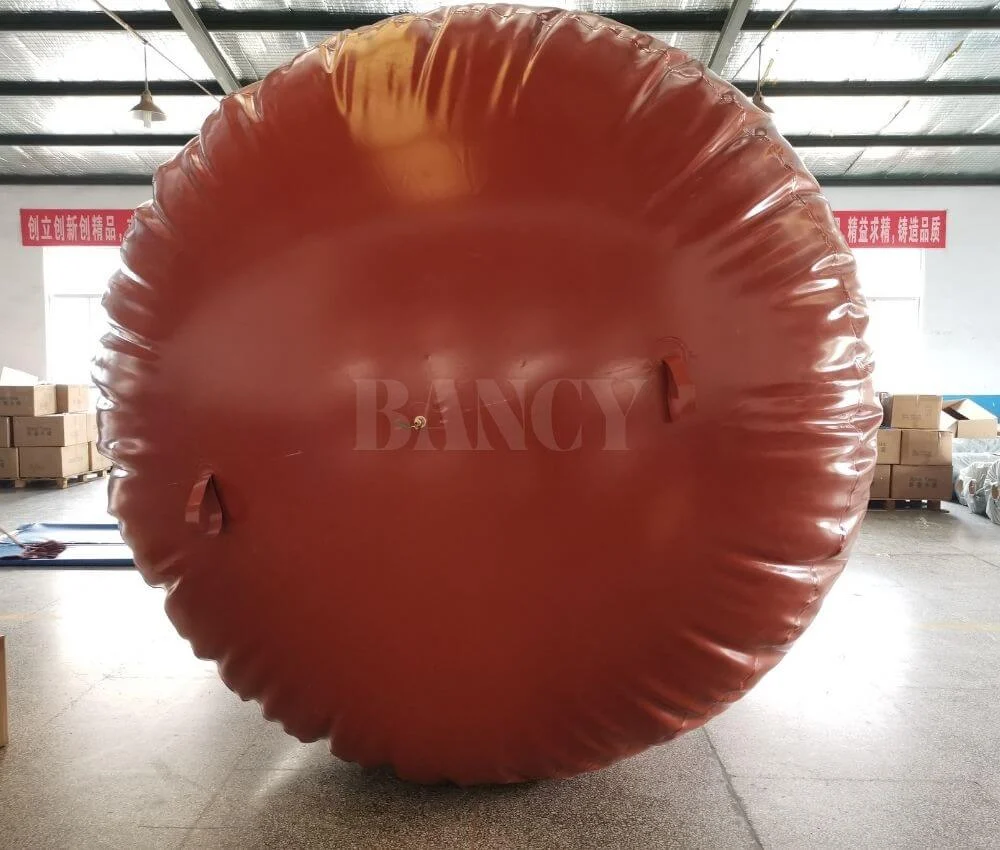 Front view of a fully inflated spherical anaerobic digester gas bag in the factory.