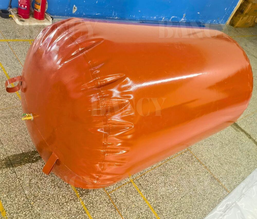 View of the rounded end pleats on a double welded biomethane storage bladder.