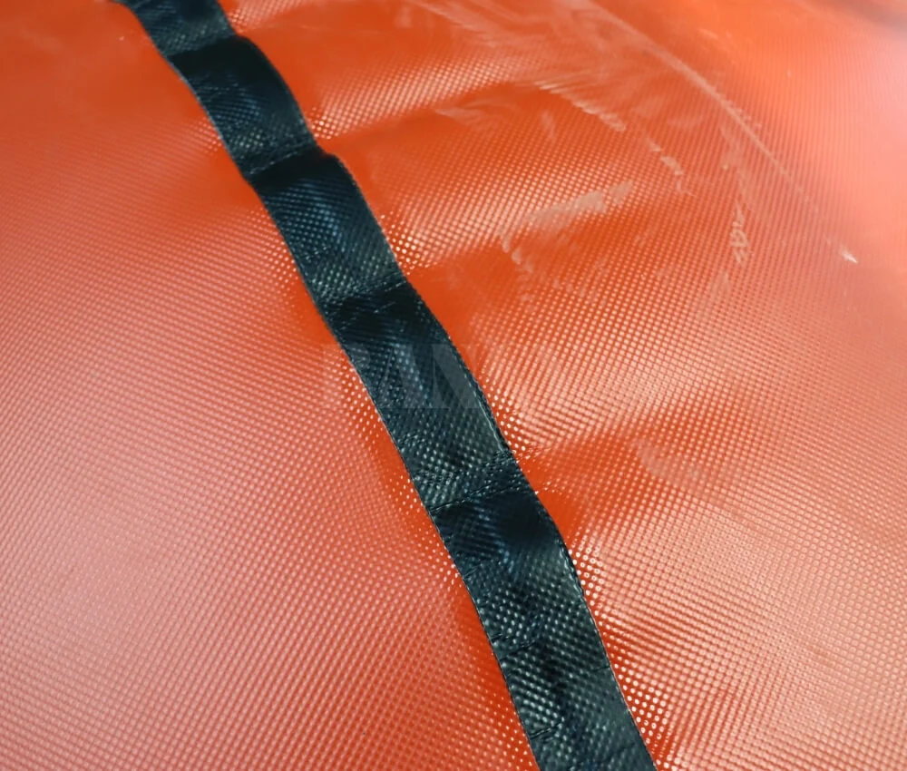 Close up of double layer reinforced seam on red mud biogas storage balloon