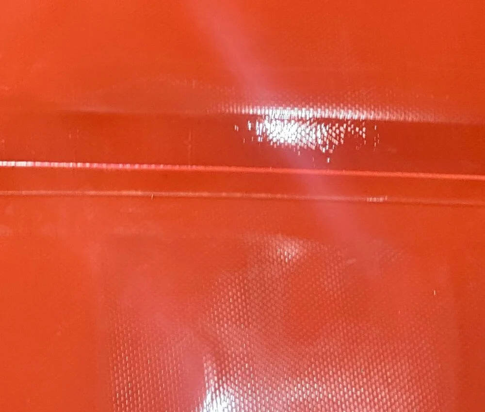 Premium Red Mud PVC Fabric Stainless steel ball valve and heavy-duty metal flange installed on a biogas storage bag.